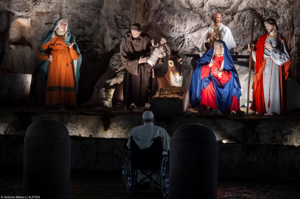 Pope Francis stops in front a nativity scene in St. Peter's Square after presiding over the first Vespers and the 'Te Deum'