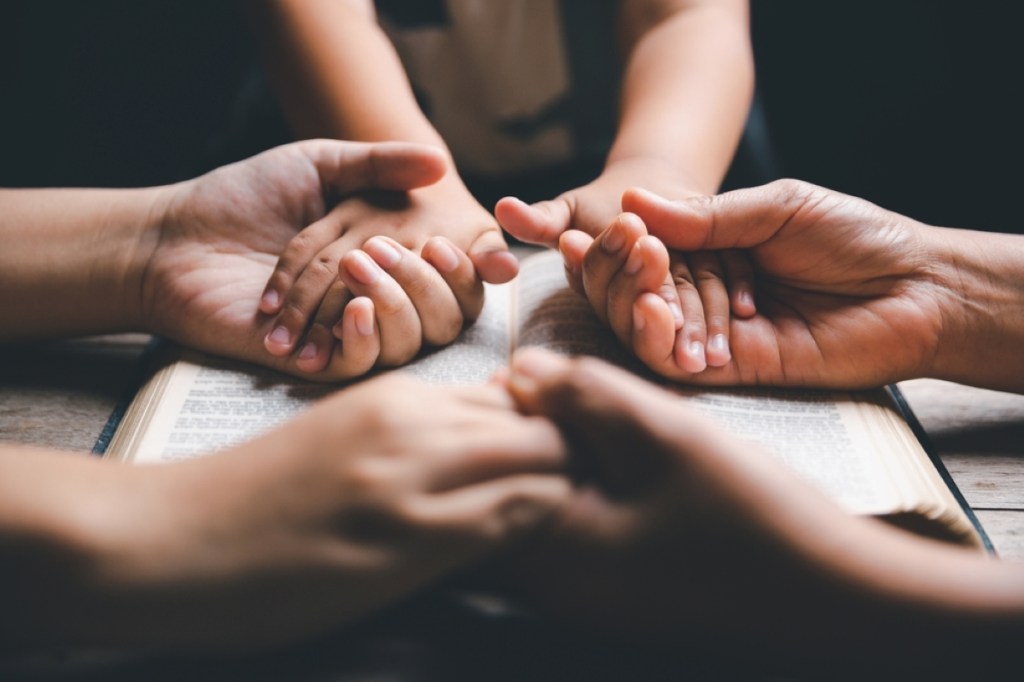 Christian family praying together