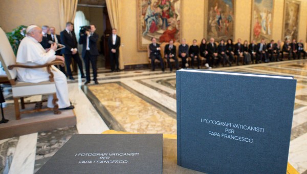 Pope Francis in a private audience with Vatican photographers