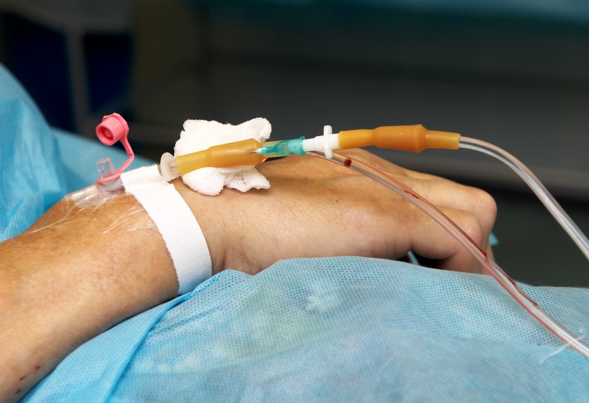 Patient with IV in hand