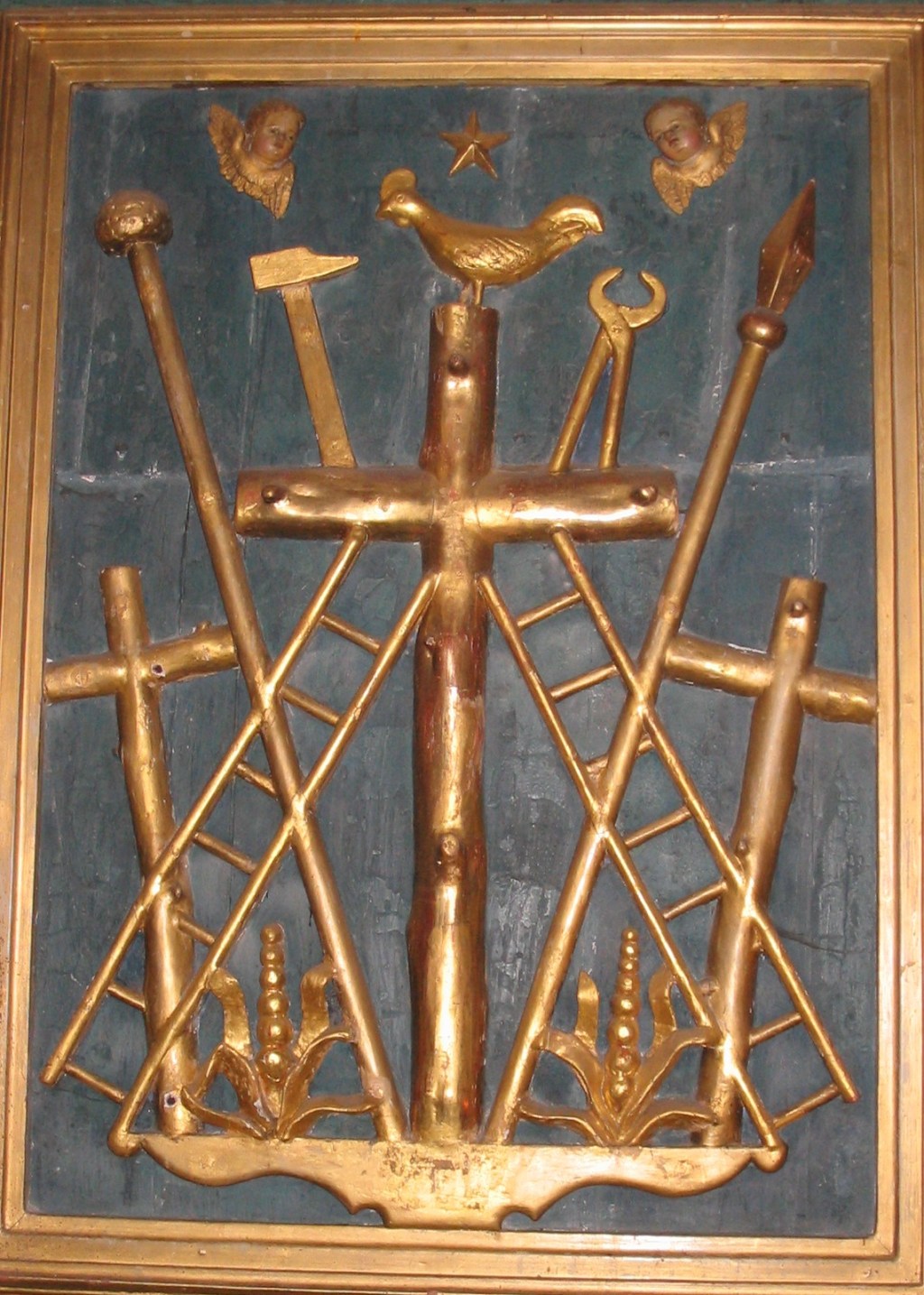 The-instruments-of-the-Passion-Saint-Pierre-church-in-Collonges-la-rouge