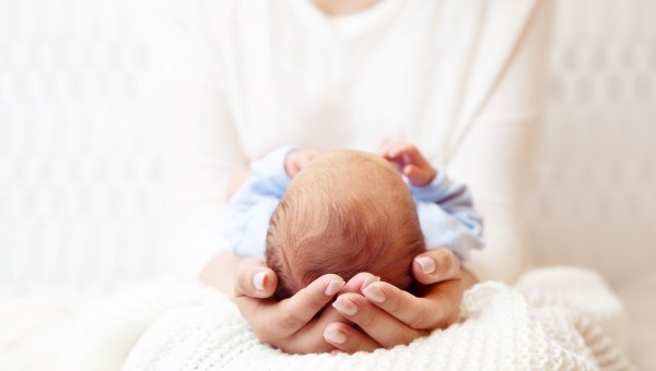 Baby Head in Mother Hands