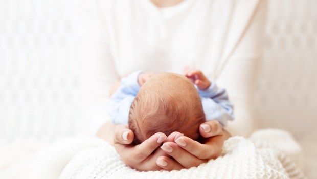 Baby Head in Mother Hands