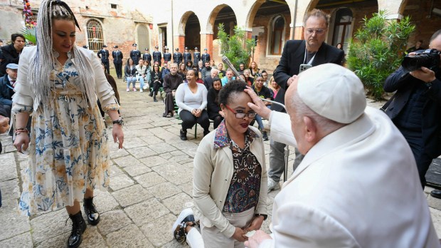 Pope Francis during a visit to inmates in the internal courtyard of the Venice Women's Prison on the Island of Giudecca as part of his visit in Venice