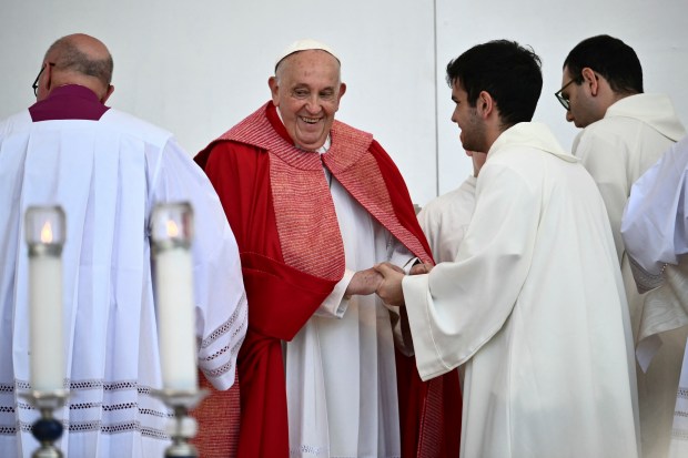 Pope Francis arrives to preside a mass at the Bentegodi stadium as part of a visit in Verona, on May 18, 2024.