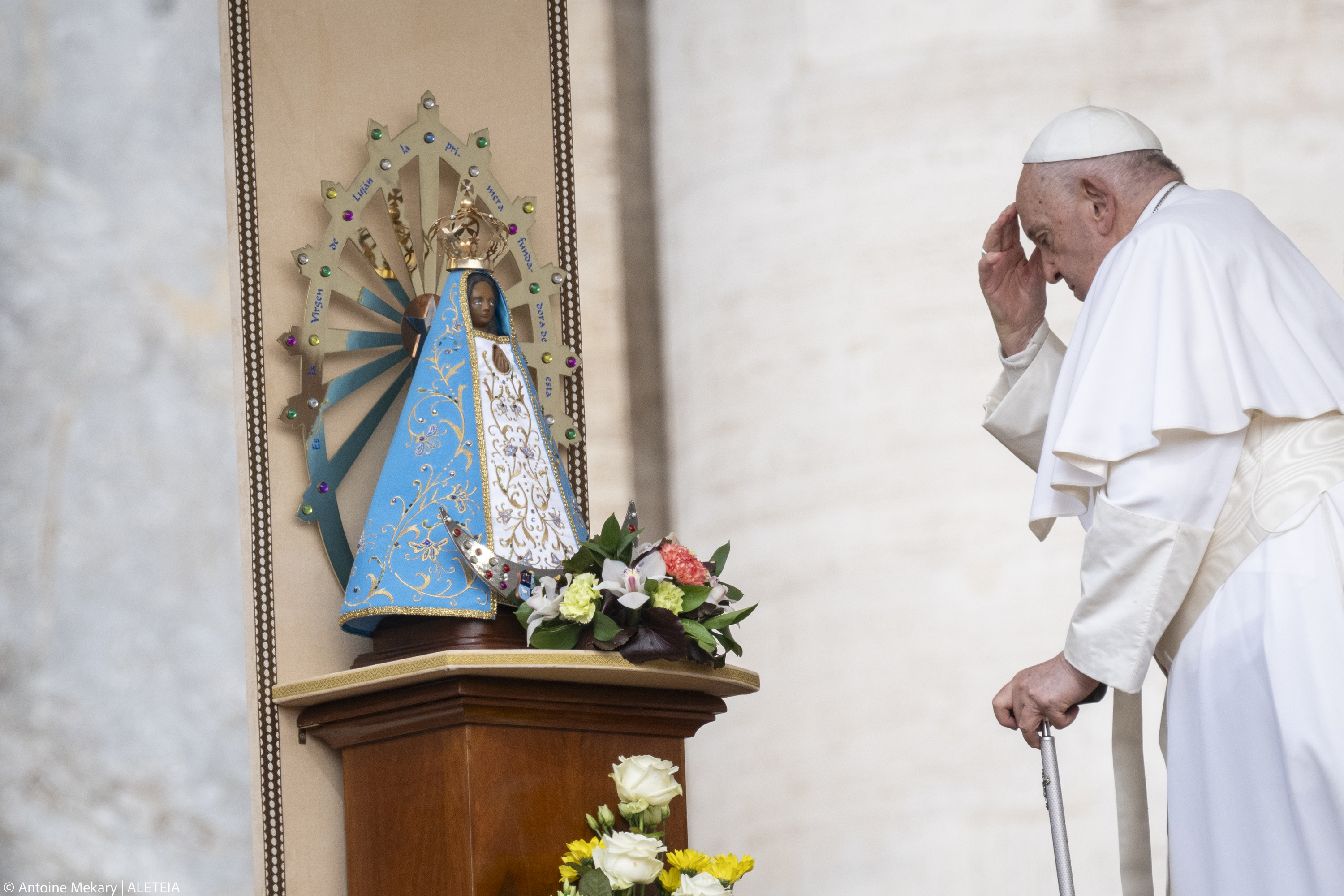 Pope Francis touches a statue of Our Lady of Lujan, during the weekly general audience on May 8, 2024 at St Peter's square in The Vatican.