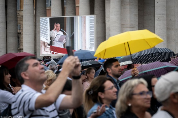 Pope Francis addresses the crowd from the window of the apostolic palace overlooking St. Peter's square during the Regina Coeli prayer on May 19, 2024 in The Vatican.