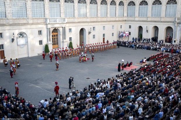 Swiss Guards take part in a swearing-in ceremony in San Damaso Courtyard, Vatican on May 06, 2024