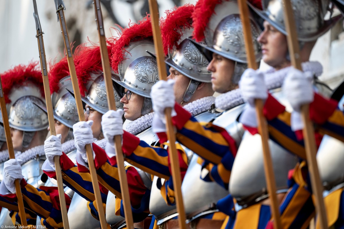 Swiss Guards take part in a swearing-in ceremony in San Damaso Courtyard, Vatican on May 06, 2024
