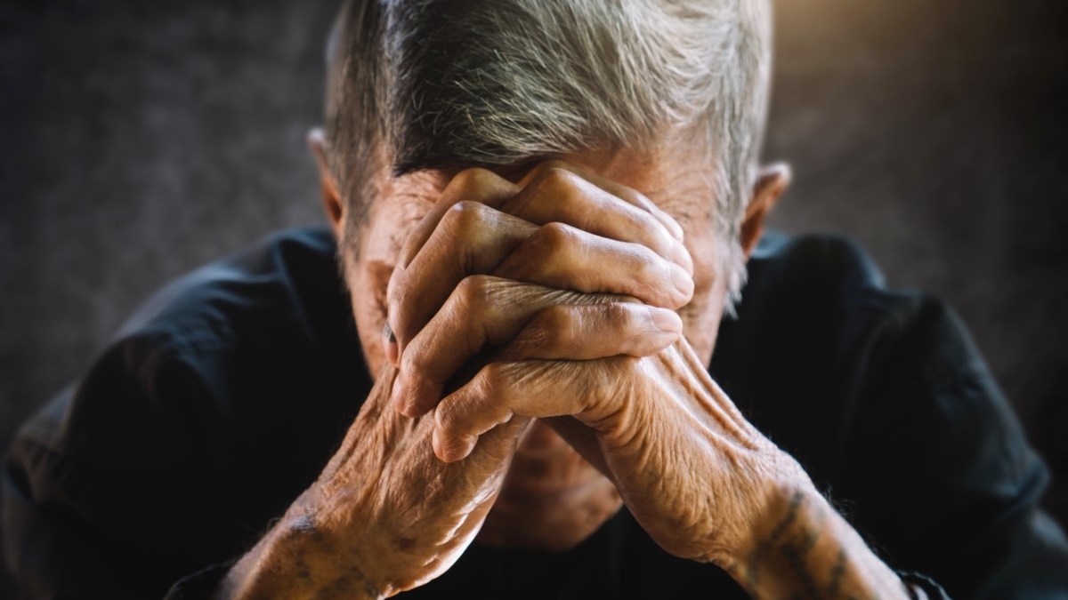 Elderly person praying