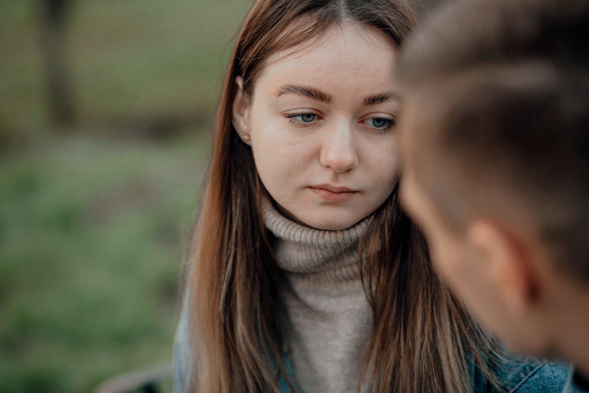 Sad woman having conversation with friend