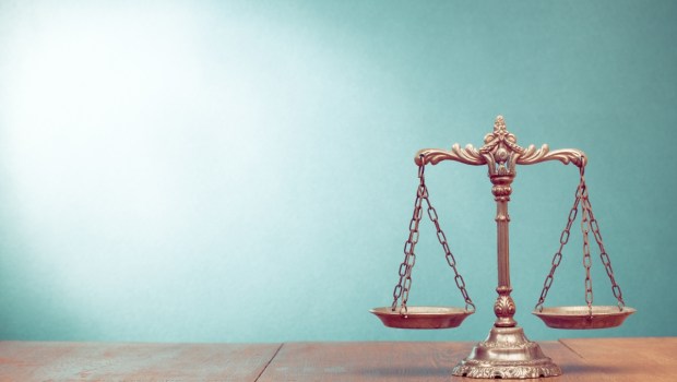 Law scales on table. Symbol of justice