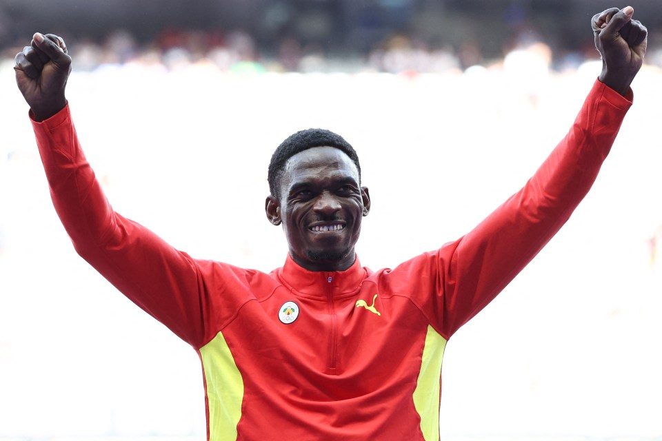 Bronze medallist Grenada's Lindon Victor celebrates on the podium during the victory ceremony for the men's decathlon athletics event during the Paris 2024 Olympic Games at Stade de France