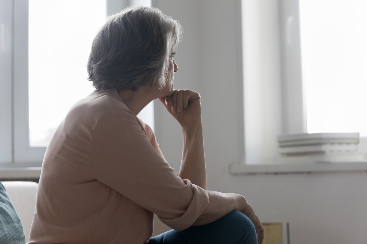 OLD-WOMAN-BACK-WINDOW-shutterstock
