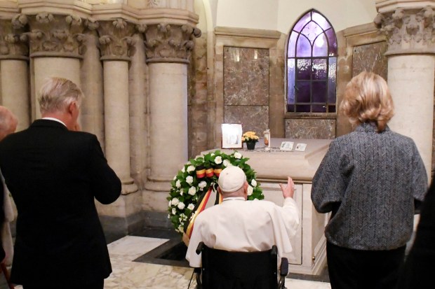 Pope Francis (C), Belgian King Philippe (L) and Queen Mathilde (R) visiting the royal crypt, below the Church of Notre-Dame de Laeken, where the tombs of many members of the Royal House of Belgium are gathered, in Laeken.