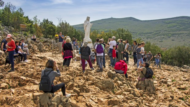 Pilgrims-in-Medjugorje-Statue-of-Virgin-Mary