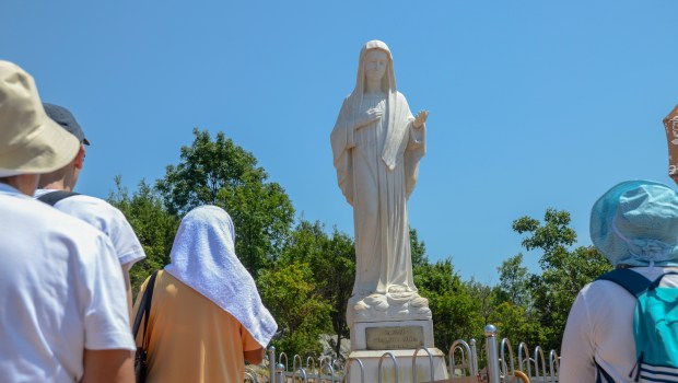 Pilgrims-in-Medjugorje-Statue-of-Virgin-Mary