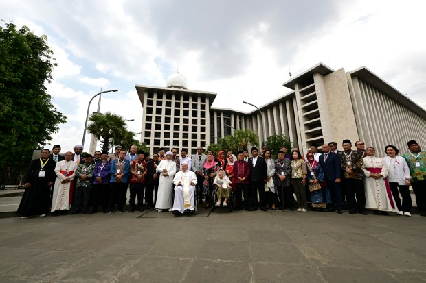 Pope Francis (centre R) poses with Grand Imam of Istiqlal Mosque Nasaruddin Umar (centre L) after an interreligious meeting with religious leaders at the Istiqlal Mosque in Jakarta on September 5, 2024.