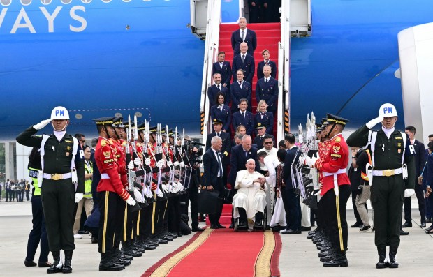 Pope Francis is greeted during his arrival at Jakarta Soekarno-Hatta International Airport on September 3, 2024.