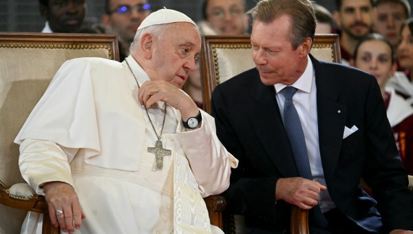 Pope Francis (L) speaks with Grand Duke Henri of Luxembourg during a welcome ceremony at the Luxembourg Findel international airport