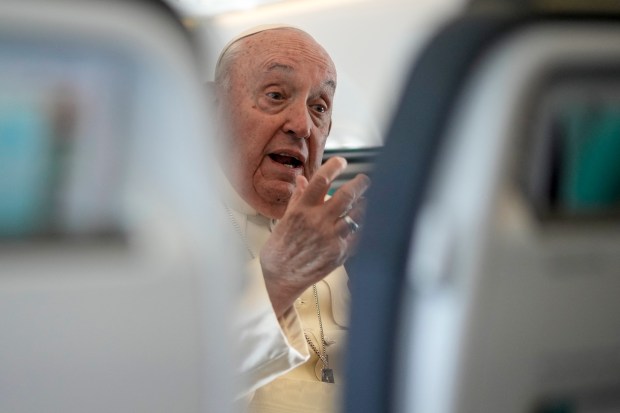 Pope Francis talks to journalists on a flight back to Rome at the end of a four-day visit to Luxembourg and Belgium on September 29, 2024