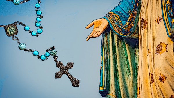 Statue of Mary indicating Rosary