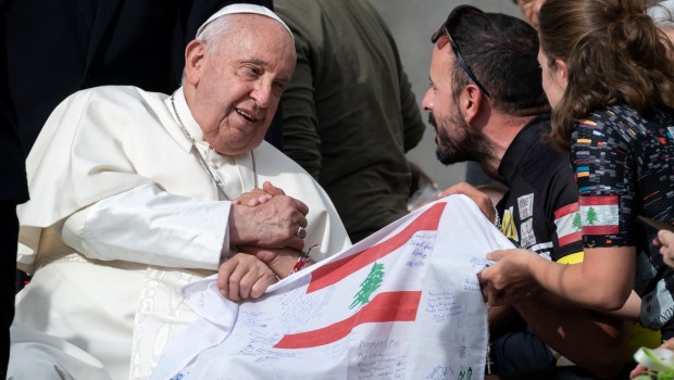 Pope Francis blesses Lebanese Lea Kallassi and Ralph Al Khoury representing Barbara Nassar Association to help cancer patients at the end of his weekly general audience in St. Peter's Square at the Vatican on Wednesday, October 9, 2024.