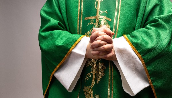 Priest praying hands