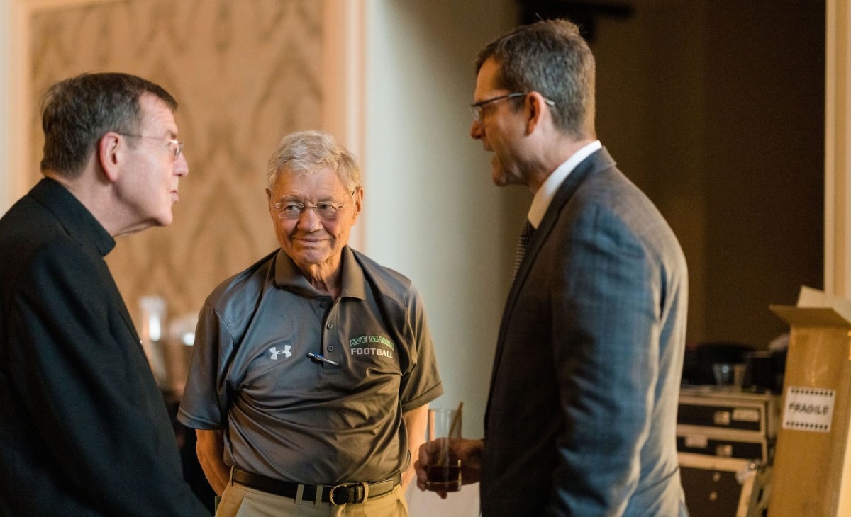 Tom Monaghan (center) with Archbishop Allen Henry Vigneron (left) and Los Angeles Chargers head coach Jim Harbaugh (right) at the 2023 Legatus Summit in Dana Point, California