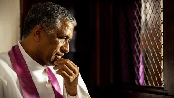 Priest hears Confession in a Mexican church