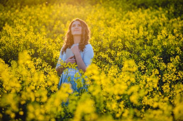 happy girl embraces the bible