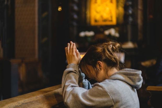 Woman praying in temple