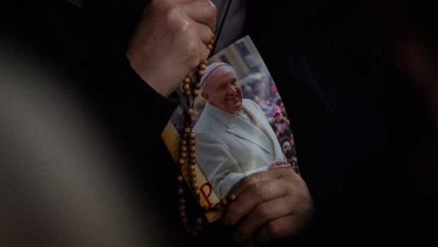 Cardinal Lazzaro You Heung-sikprays during a rosary prayer for Pope Francis' health in St. Peter's Square at the Vatican, Tuesday, March 07, 2025.