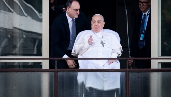 Pope Francis waves from a window of the Gemelli hospital before to be discharge after a five weeks hospitalization for pneumonia, in Rome on March 23, 2025.