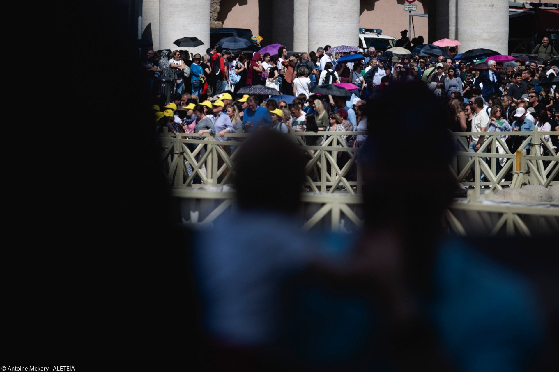 Pilgrims and visitors queue at St Peter's Square to enter St Peter's Basilica and pay respects to the late Pope in the Vatican on April 23, 2025