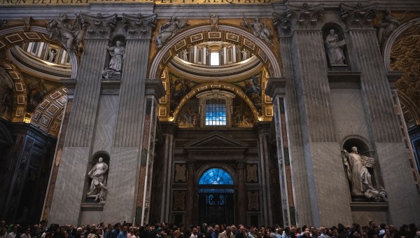 People stay in a line to pay respect to coffin with body of Pope Francis displayed at Saint Peter's Basilica in Vatican on April 23, 2025