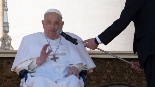 Pope Francis is pushed in a wheelchair on St. Peter's square to conduct the Angelus prayer in The Vatican, on April 6, 2025.