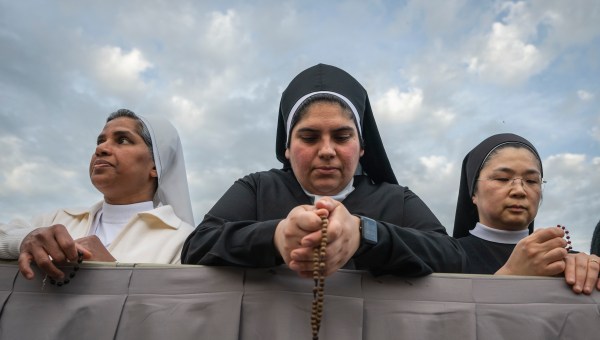 Devotees attend a Rosary in homage to Pope Francis following his death in Saint Peter's Square, the Vatican, on April 21, 2025