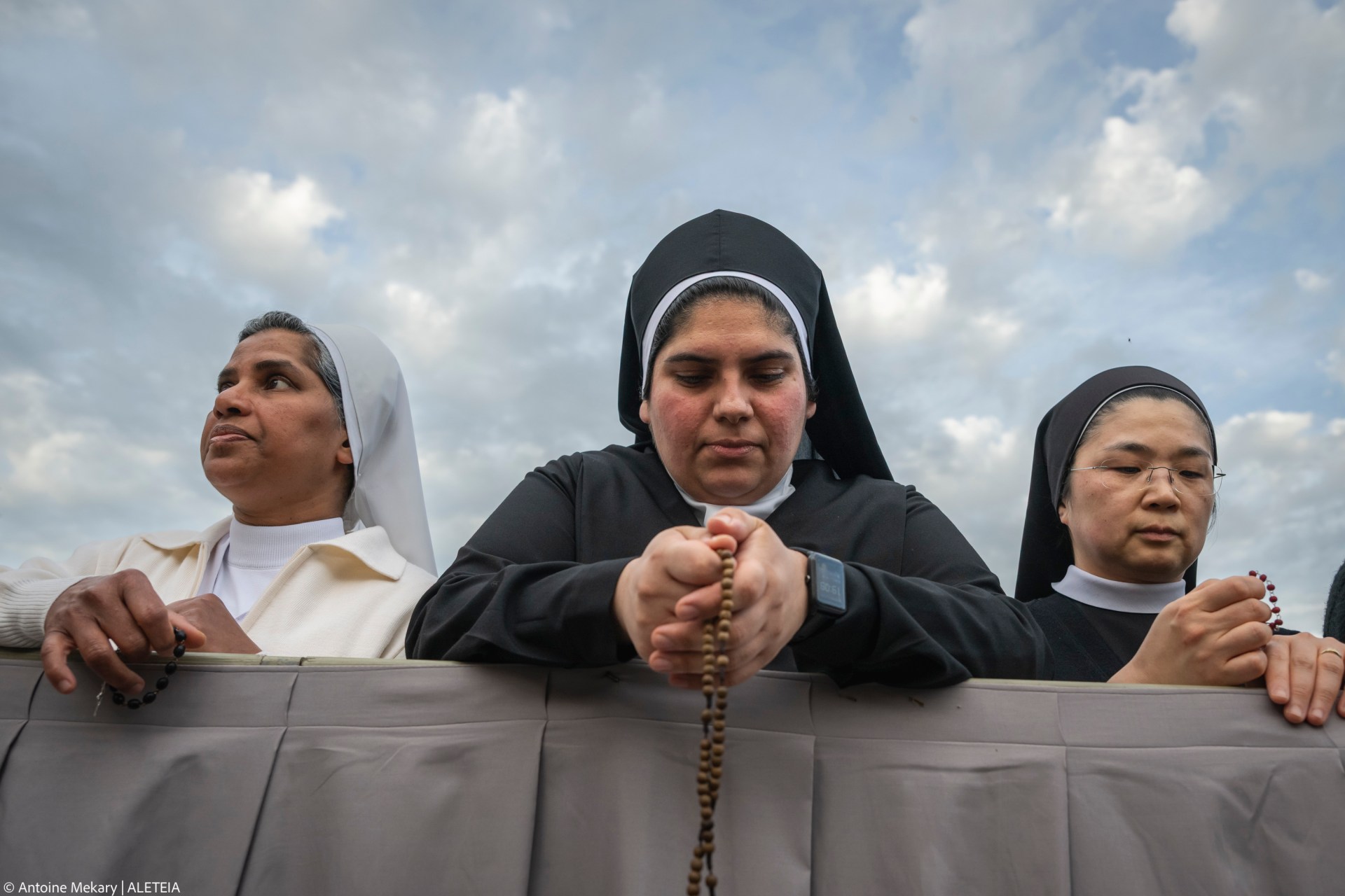 Devotees attend a Rosary in homage to Pope Francis following his death in Saint Peter's Square, the Vatican, on April 21, 2025