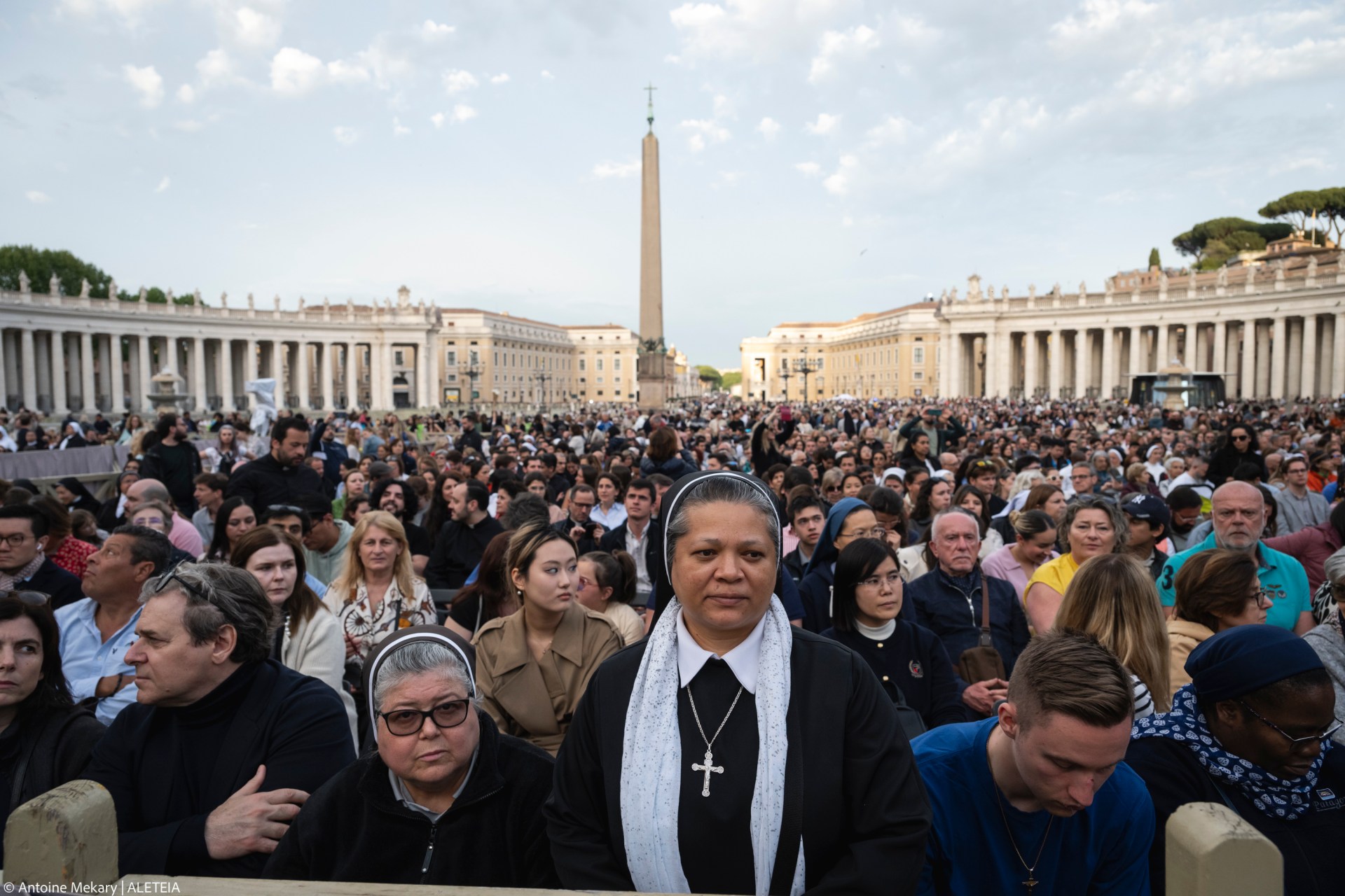 Devotees attend a Rosary in homage to Pope Francis following his death in Saint Peter's Square, the Vatican, on April 21, 2025