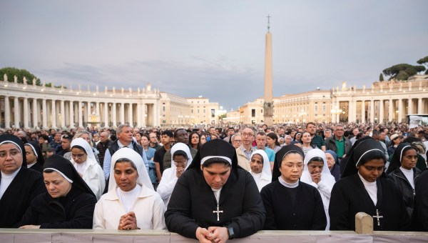 Devotees attend a Rosary in homage to Pope Francis following his death in Saint Peter's Square, the Vatican, on April 21, 2025