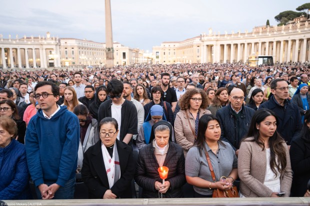 Devotees attend a Rosary in homage to Pope Francis following his death in Saint Peter's Square, the Vatican, on April 21, 2025