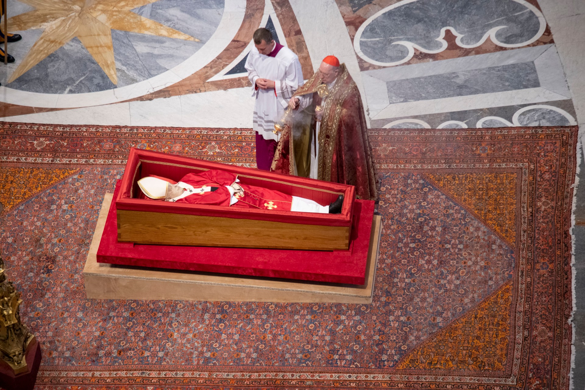 Pallbearers carry the coffin of the late Pope Francis inside St Peter's Basilica as it is transported in a procession from the chapel of Santa Marta to St Peter's Basilica, following the Pope's death, in the Vatican on April 23, 2025.