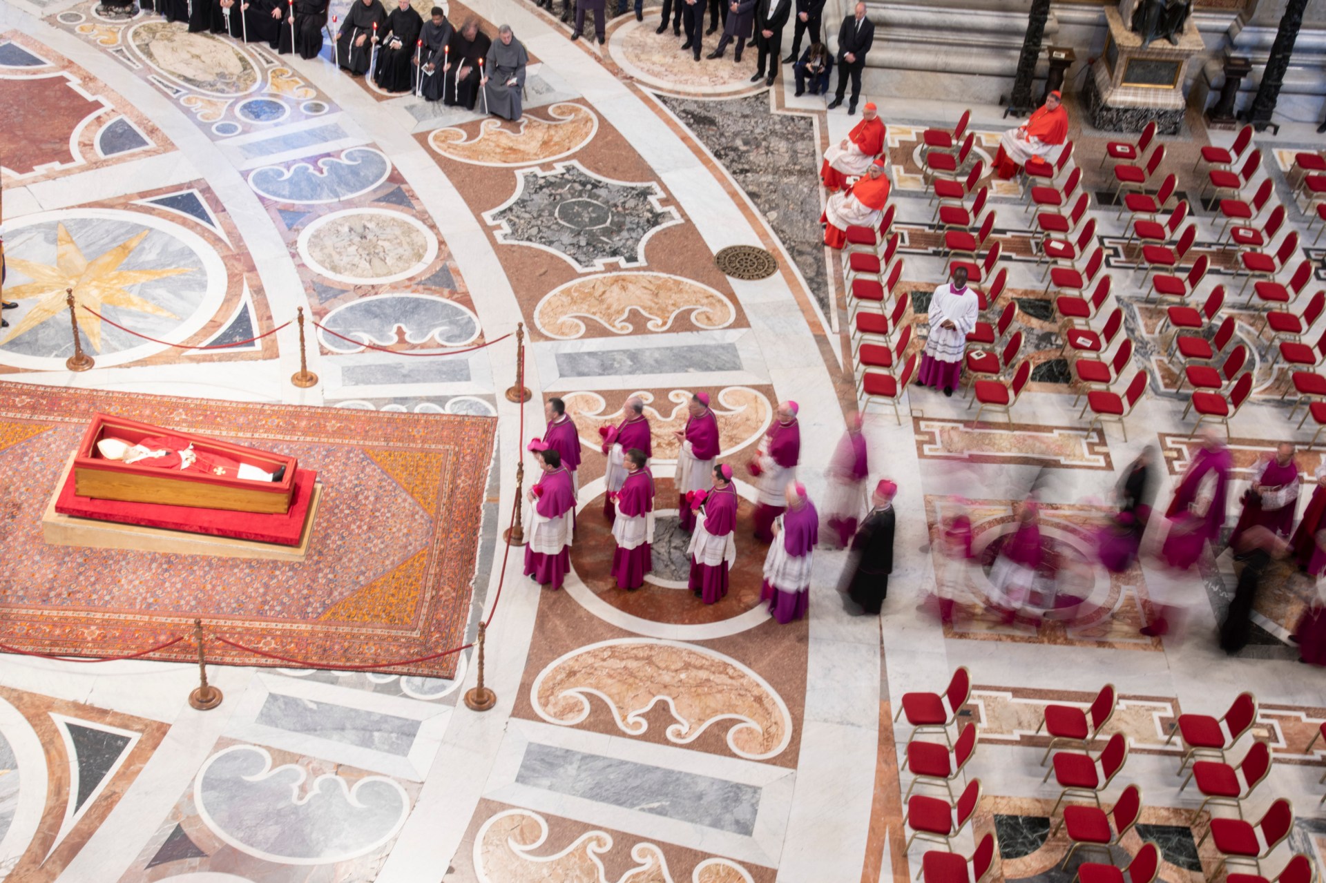 Pallbearers carry the coffin of the late Pope Francis inside St Peter's Basilica as it is transported in a procession from the chapel of Santa Marta to St Peter's Basilica, following the Pope's death, in the Vatican on April 23, 2025.