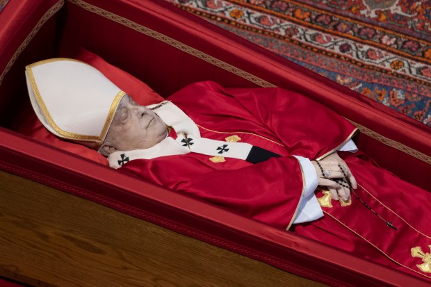 coffin of the late Pope Francis inside St Peter's Basilica as it is transported in a procession from the chapel of Santa Marta to St Peter's Basilica, following the Pope's death, in the Vatican on April 23, 2025.