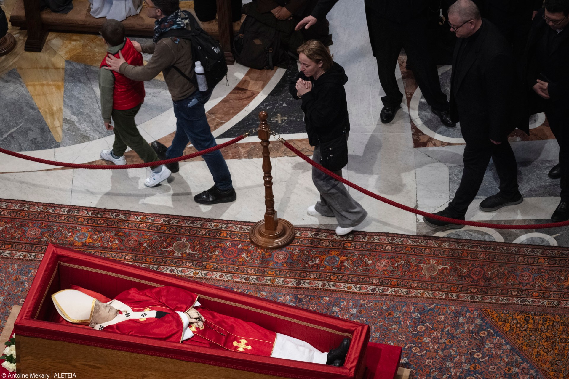 People pay their respects to late Pope Francis as he lies in state at St Peter's Basilica in The Vatican, on April 24, 2025.