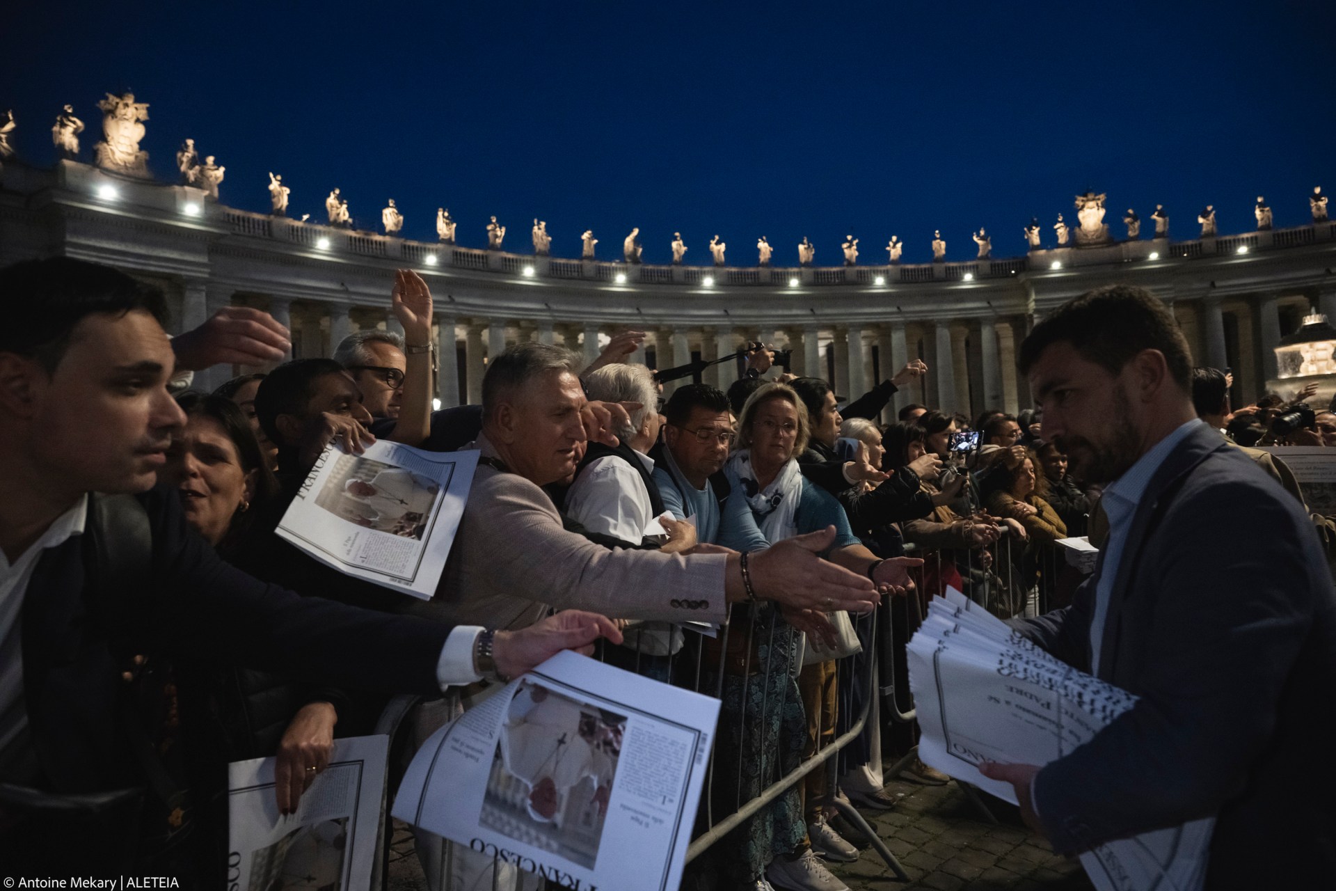 A man holds a special edition of the Vatican newspaper L'Osservatore Romano announcing the death of Pope Francis, in St. Peter's Square