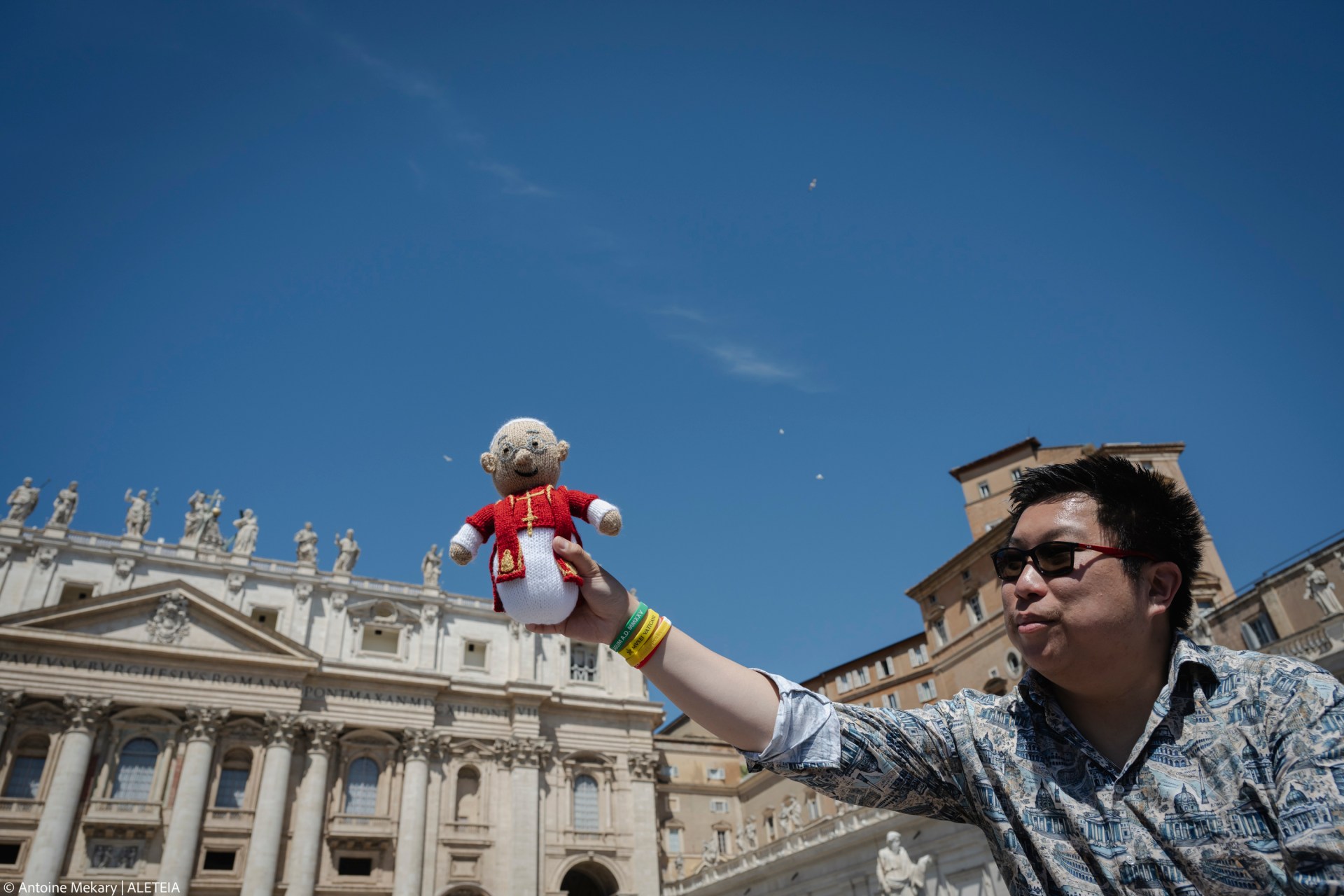 A faithful holds a puppet during Pope Leo XIV's weekly general audience on May 28, 2025, in St. Peter's Square at the Vatican