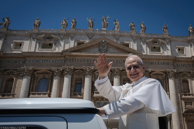 Pope Leo XIV waves to the crowd as he leaves on a popemobile after the weekly general audience at St Peter's Square at The Vatican, on May 28, 2025