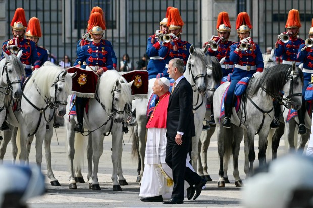Spain's Felipe VI and Pope Leo XIV review the horse guard at the Royal Palace in Madrid on June 6, 2026